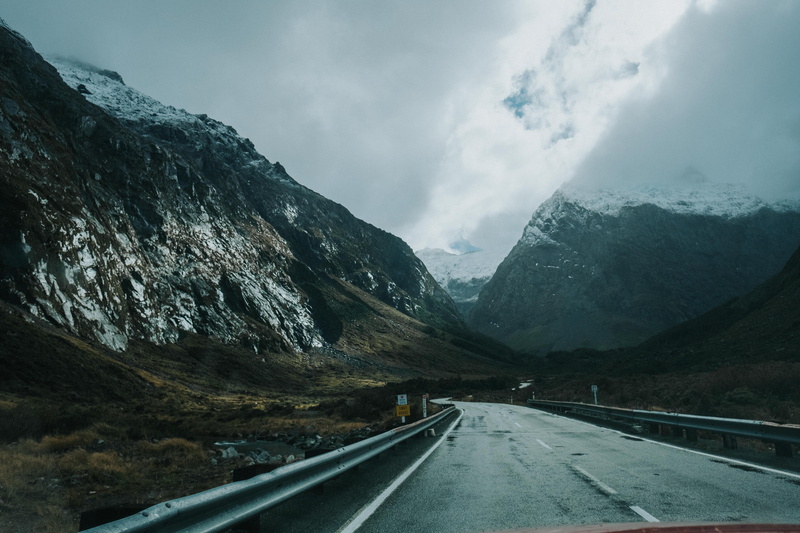 crash barrier, direction, new zealand, symbol, dividing line, ice, sky, cloudy, mountain range, mode of transportation, alps, sunlight, road marking, diminishing perspective