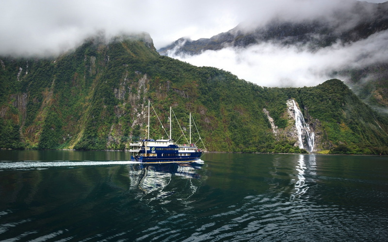 2K, Bowen If, the ship, waterfall Bowen, Milford Sound, mountains, Fiordland National Park, the fjord Milford Sound, New Zealand