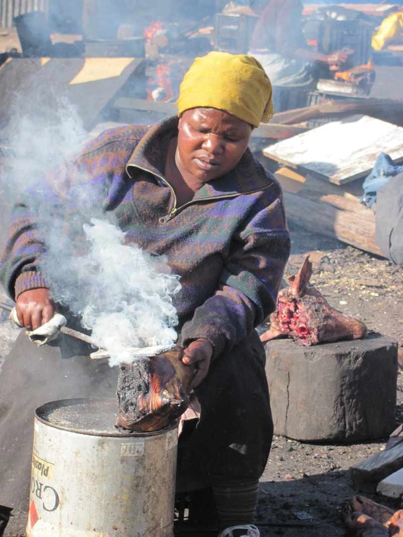 south africa, adult, poverty, one person, men, burning, standing, casual clothing, three quarter length, day, cooking, food, township, real people, heat - temperature