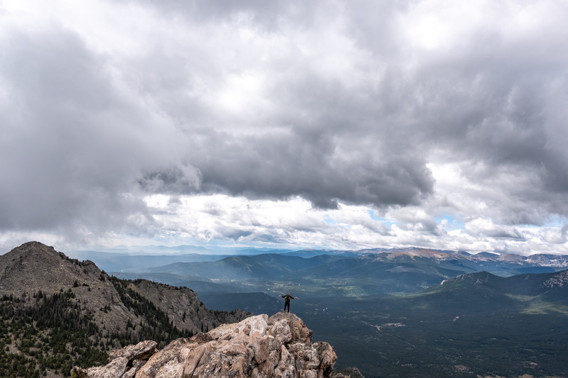 real people, rock, wanderlust, non-urban scene, scenics - nature, day, one person, tranquility, view, panoramic, mountain top, rock - object, estes park