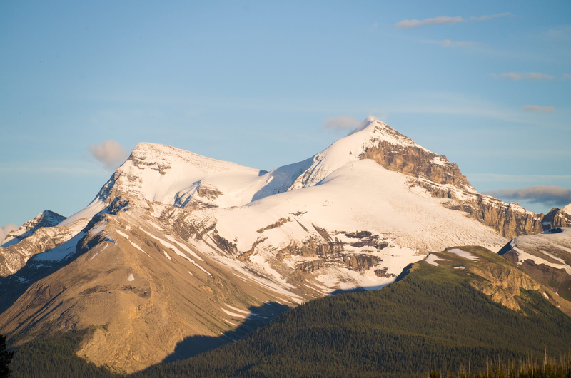 blue sky, mountain peak, outdoors, woodland, crest, sky, beauty in nature, no people, peak, wilderness, landscape, non-urban scene, summit, snowcapped mountain