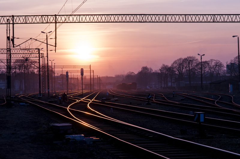 outdoors, steel, sunset, industrial, line, sunlight, railroad Track, sky, rail transportation, area, railroad, train - vehicle, technology, connection