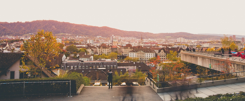 high angle view, sunset, mountain, sky, city life, roof, cityscape, built structure, residential district, eth zürich, switzerland, city, real people, crowd