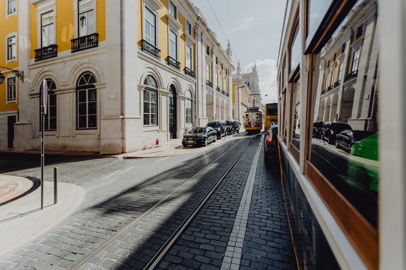 window, street, track, built structure, rail transportation, Europe, travel, architecture, sky, yellow, tram, famous, nature, land vehicle, city, no people