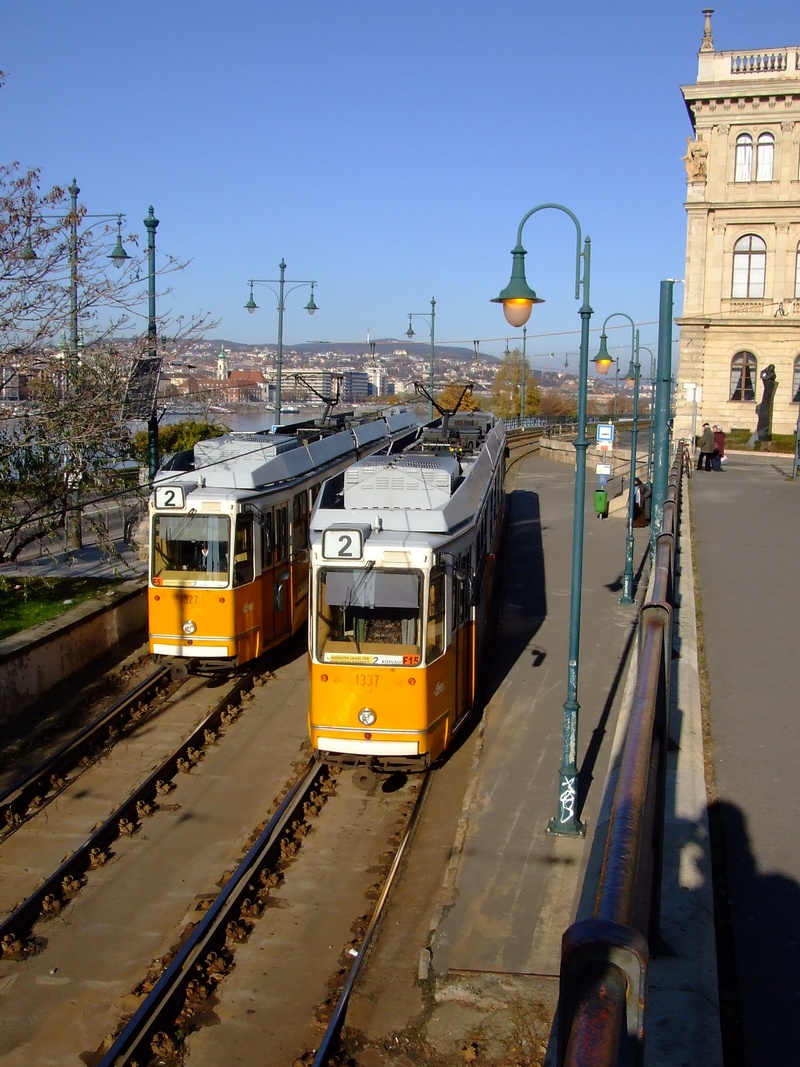 city, budapest, travel, land vehicle, train, railroad track, rail transportation, outdoors, mode of transportation, tram, street light, incidental people