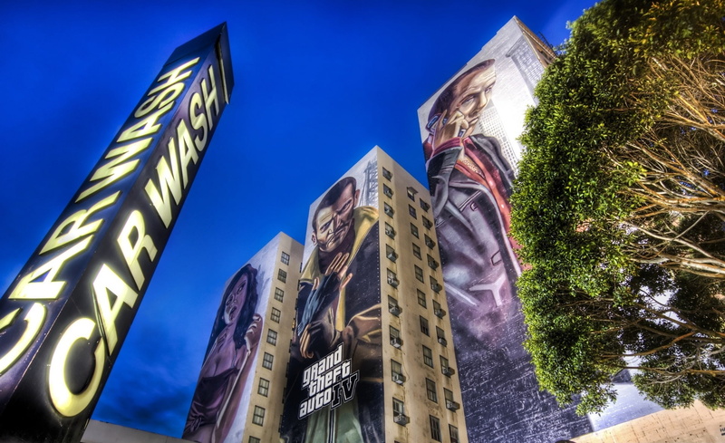 city, clear sky, outdoors, built structure, Grand Theft Auto, auto, ad, sky, street ad, building, architecture, gta for street ad, digital, sunlight, tree