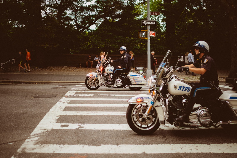 road, speed, men, adult, tree, pedestrian, people, plant, police, mode of transportation, driving, biker, ride, mode of Transport, lane, transportation