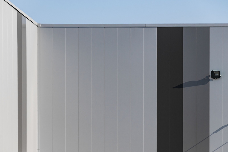 warehouse, minimal, corner, closet, hanged, building exterior, wardrobe, wall - building feature, sliding door, explore, metal, sunny, sunlight, angle