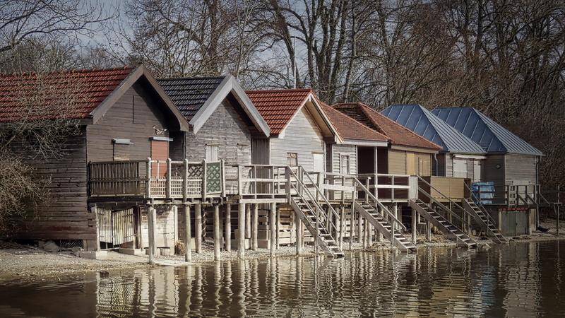 built structure, nature, ammersee, wood, bank, body, wooden post, boat house, architecture, residential district, woods, boat rental, day, bare tree, stilt house