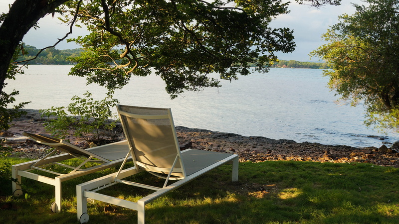 grass, land, green color, island, tree, lake, no people, day, 4K, beach chair, outdoors, plant, tranquility, sea, travel, vacation, beauty in nature, table