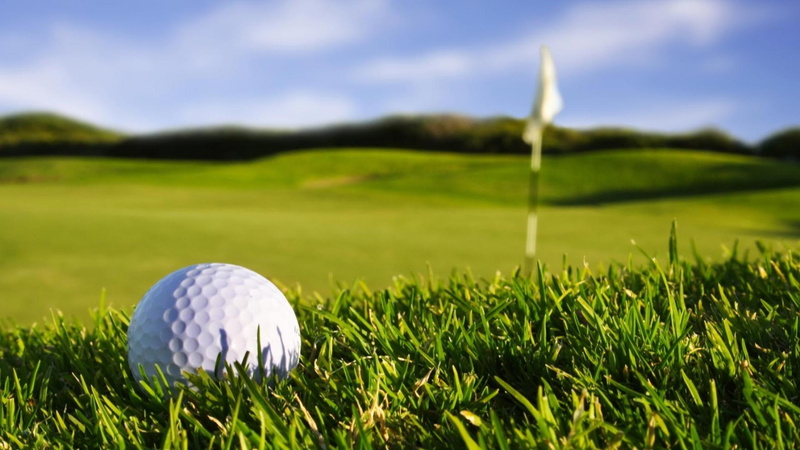 golf, green color, relaxation, plant, close-up, ball, cloud - sky, leisure activity, golf ball, sport, golf course, outdoors, sky, putting green, activity