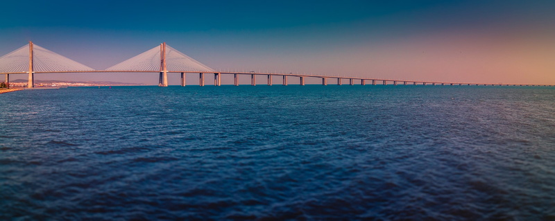 nature, tranquility, horizon over water, blue, river, built structure, outdoors, water, portugal, horizon, sunset, the river tagus, lisbon bridge, tagus