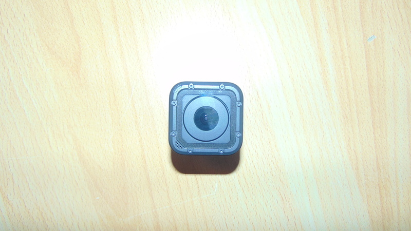 GoPro, camera - photographic equipment, still life, wood, shape, indoors, wall - building feature, no people, single object, black color, close-up, camera