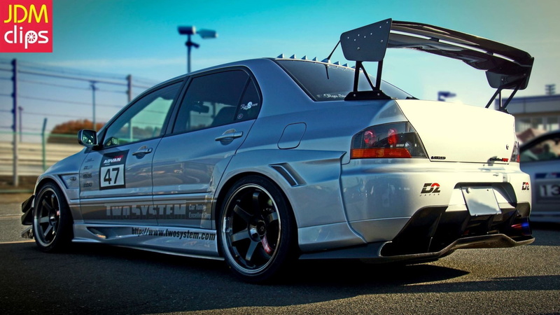 police car, white color, sky, road, land vehicle, transportation, outdoors, communication, side view, nature, day, car, travel, no people, JDM, Mitsubishi Lancer