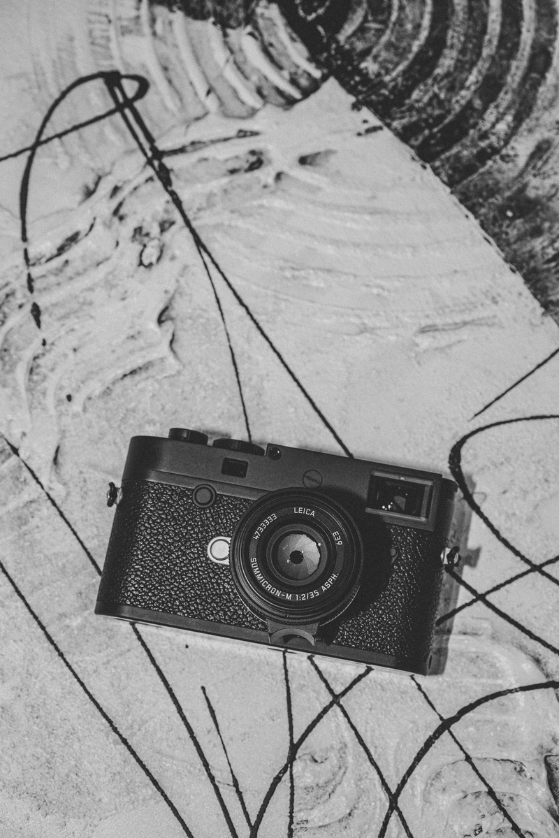 apparel, high angle view, electronics, leica, plywood, digital camera, wood, strap, shorts, vintage, retro styled, still life, floor, indoors, close-up