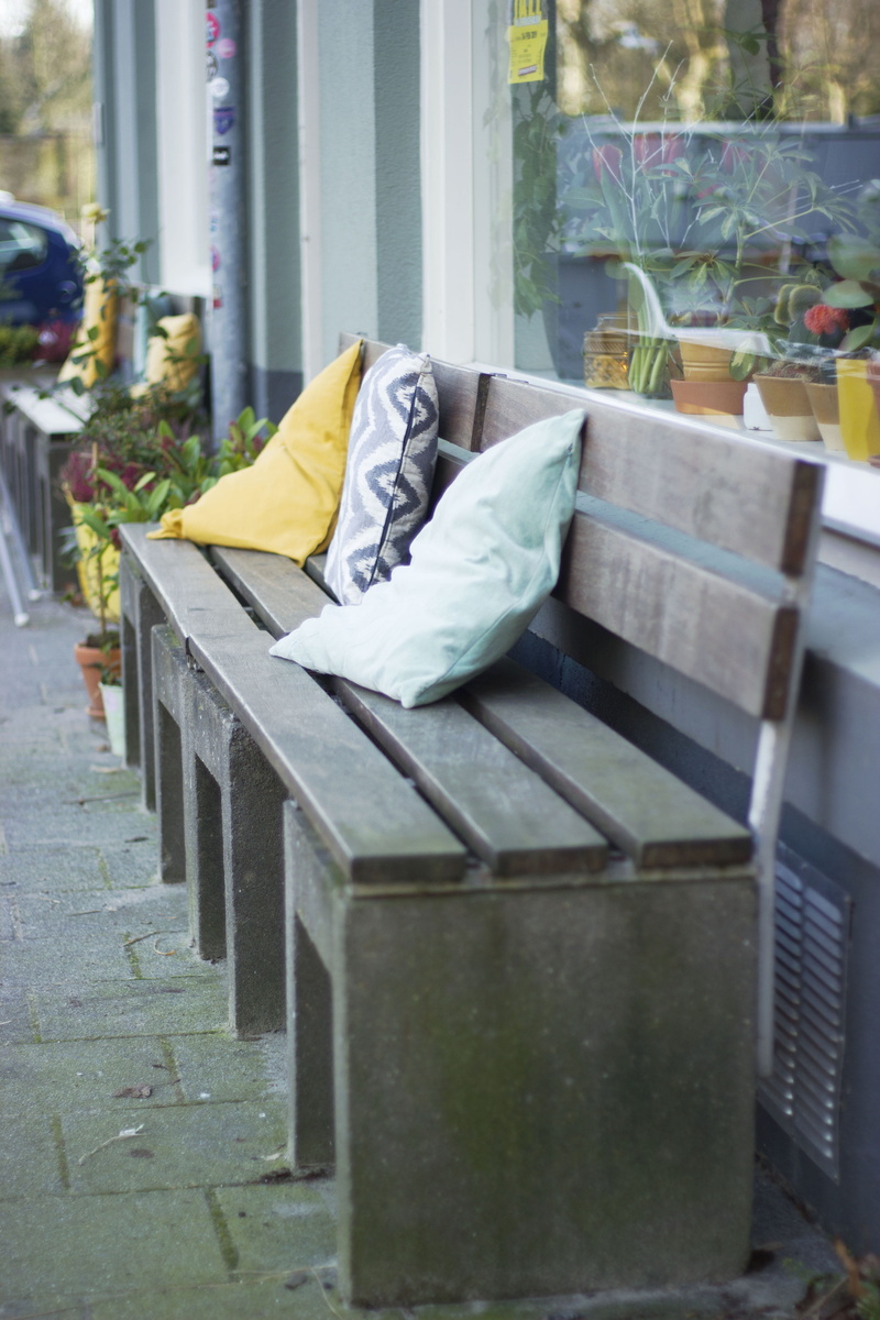 seat, chair, pillow, bunk bed, selective focus, bed, green color, day, handrail, no people, potted plant, flowering plant, home decor, arbour, pergola