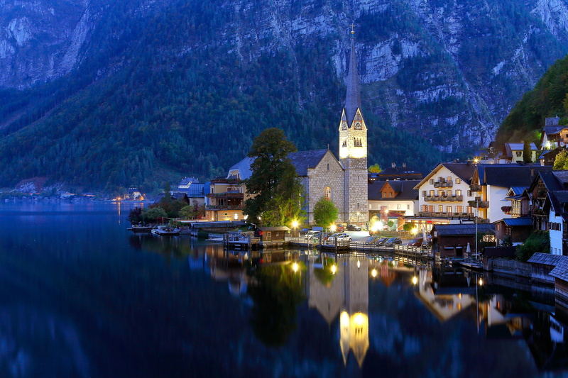 building, building exterior, no people, illuminated, hallstatt, reflection, austria, religion, waterfront, tree, built structure, spirituality, water, church