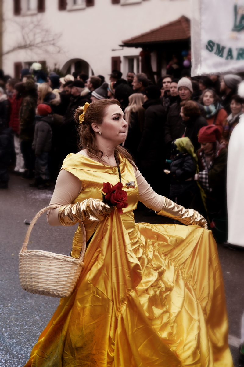 foolish, city, beauty, clothing, lifestyles, outdoors, princess, fools, beautiful woman, real people, crowd, focus on foreground, standing, day, incidental people
