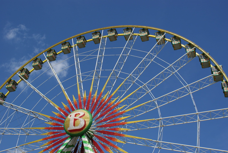 Fair, folk festival, leisure activity, blue, built structure, arts culture and entertainment, travel destinations, clear sky, Ferris Wheel, shape, semi-circle