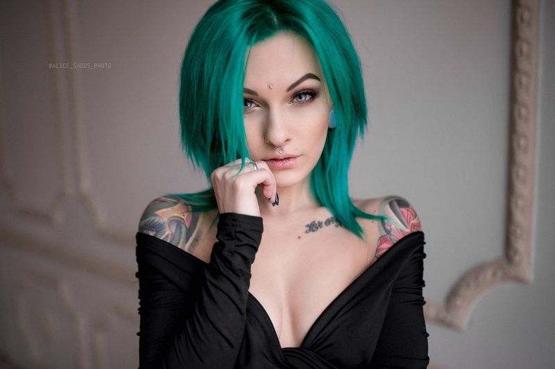 looking at viewer, bare shoulders, tattoo, dyed hair, Stretched ears, black clothing, Sasha Brink, piercing, depth of field, pierced septum, face, portrait