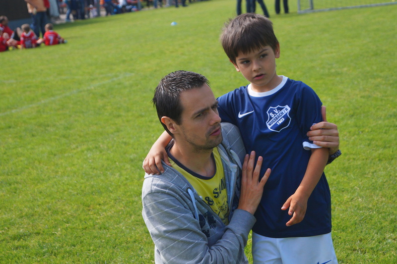 males, green color, the son of, teenager, game, leisure activity, father, men, adolescence, young men, looking at camera, football, positive emotion, two people