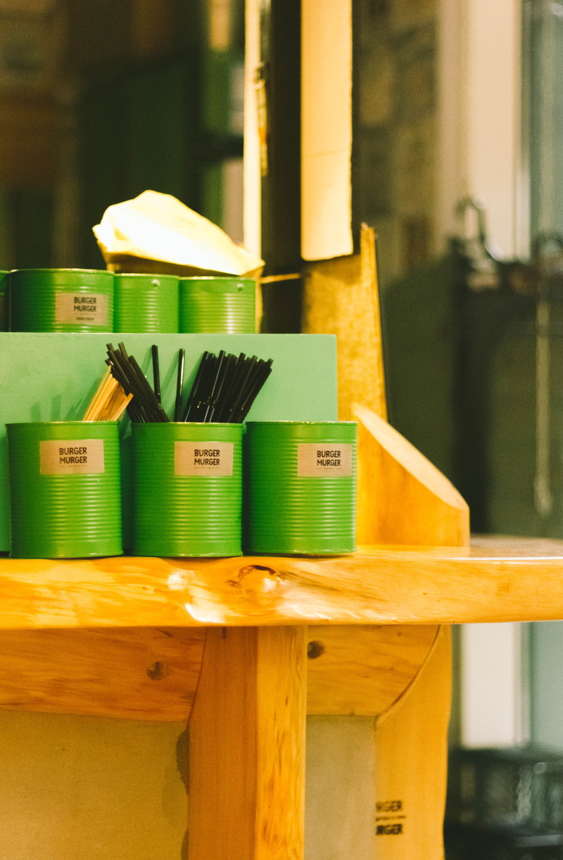 group of objects, day, brown, wooden, wood - material, furniture, can, table, blurred background, yellow, green color, stack, green, cans, built structure