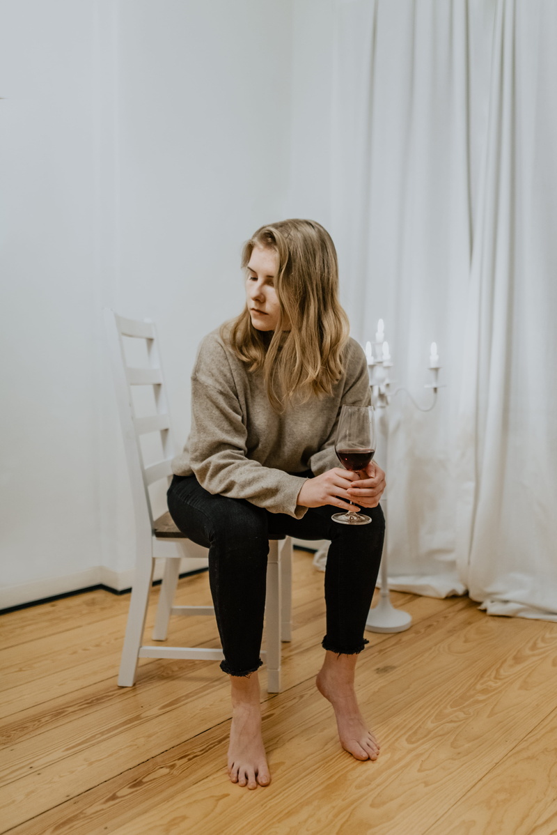 curtain, flooring, real people, sleeve, white, clothing, beside, one person, hair, chair, hardwood, beverage, blond hair, wireless technology, 5K, full length