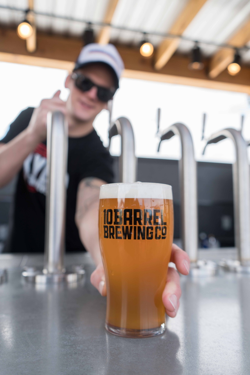 sunglasses, pilsner, beer, blur, lemonade, front view, holding, coffee cup, people, printed, juice, bokeh, beverage, bartender, milk, barrel, drink, text