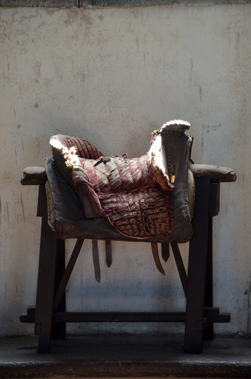saddle, obsolete, home interior, absence, shoe, textile, bad condition, clothing, relaxation, old, downlight, indoors, built structure, wall - building feature