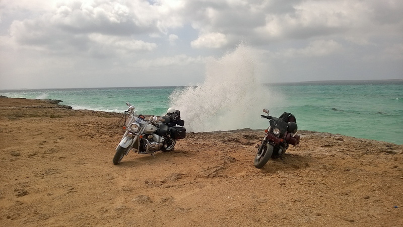 sea, horizon over water, motorcycles, people, nature, water, motorcycle, day, motion, sky, land, wave, mode of transportation, beach, cloud - sky, farasan island
