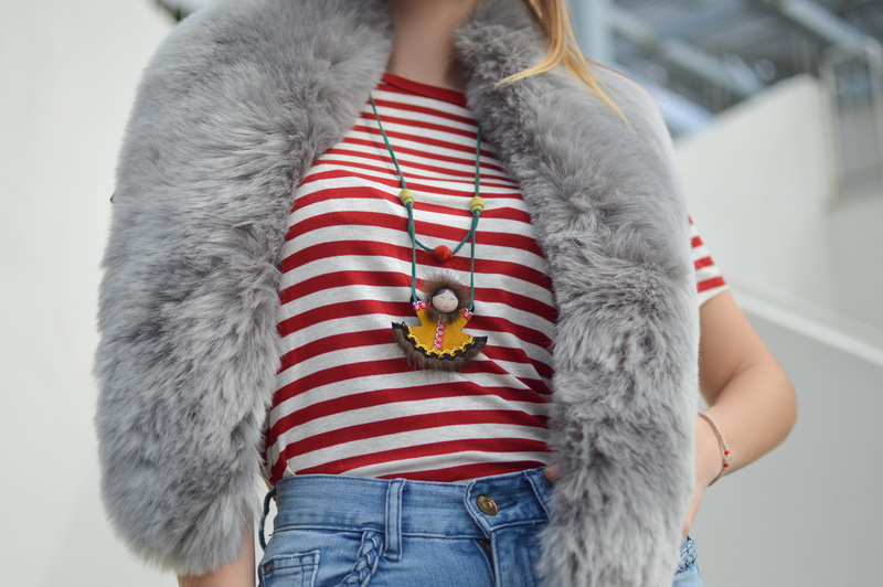 daytime, wearing, crew, faux fur, lady, adults only, bottoms, focus on foreground, people, red, t, faux, females, one Person, wall, woman, blue, clothing