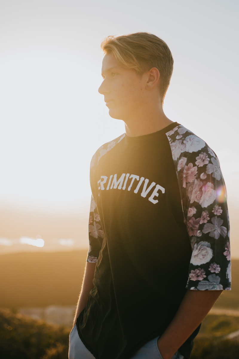 looking, one person, double peak park, lifestyles, teenager, pants, outdoors, focus on foreground, white, sunlight, carlsbad, t-shirt, looking away, real people