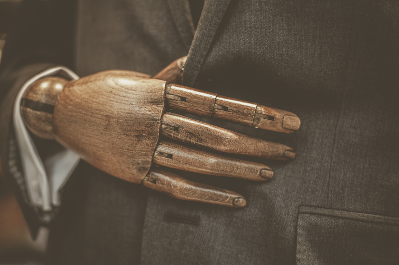 bronze, wood - material, clothing, operating theatre, cutlery, one person, wood, silver, holding, metal, wooden, accessories, cuff, human body part, glove
