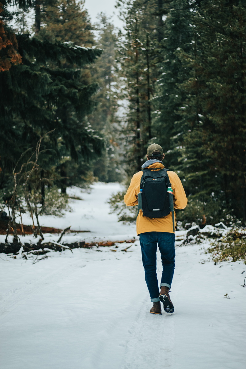 day, warm clothing, land, person, sports, outdoors, cold temperature, lifestyles, shoe, plant, one person, ice, snow, footwear, nature, tree, apparel, carrying