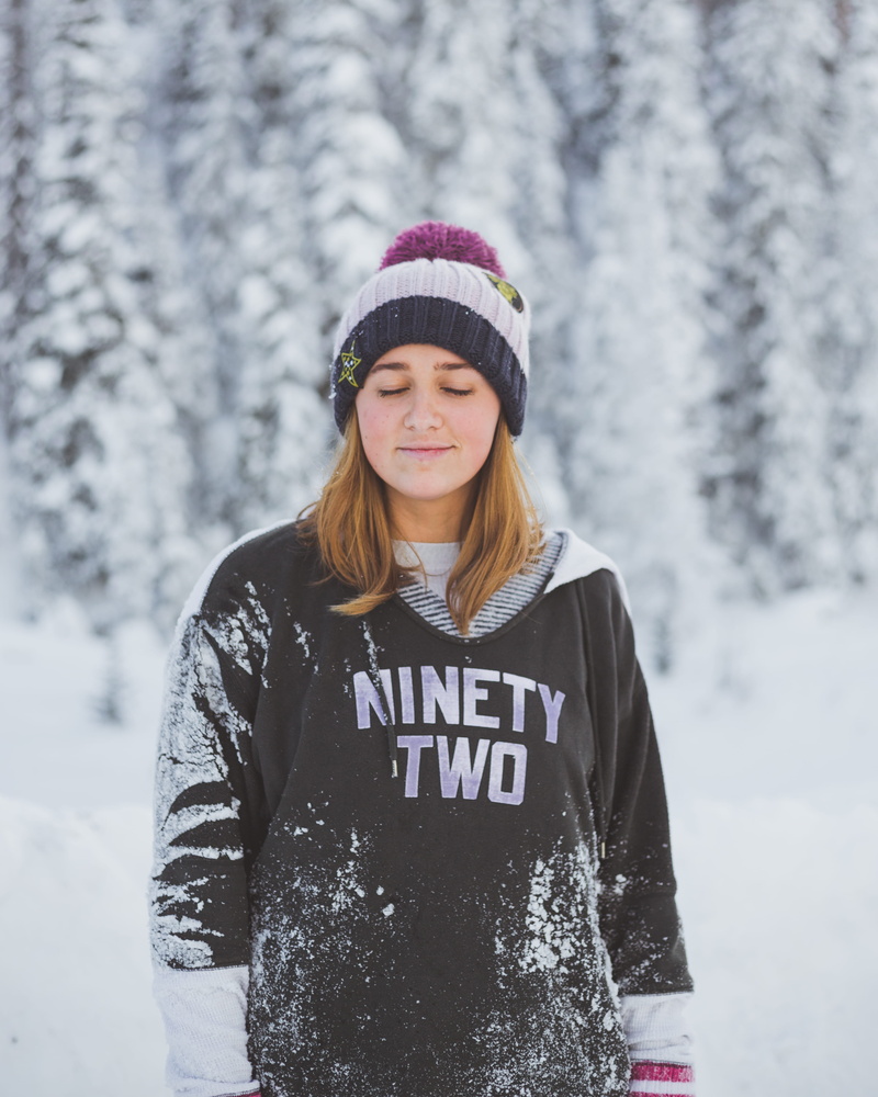 hat, sleeve, leisure activity, sweatshirt, woman, beanie, sweater, portrait, apparel, cap, long sleeve, real people, nature, front view, text, female, person