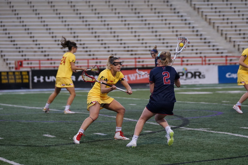 sunglasses, outdoors, accessory, shorts, human, football, team sport, stadium, child, tennis racket, motion, full length, racket, focus on foreground, sports uniform