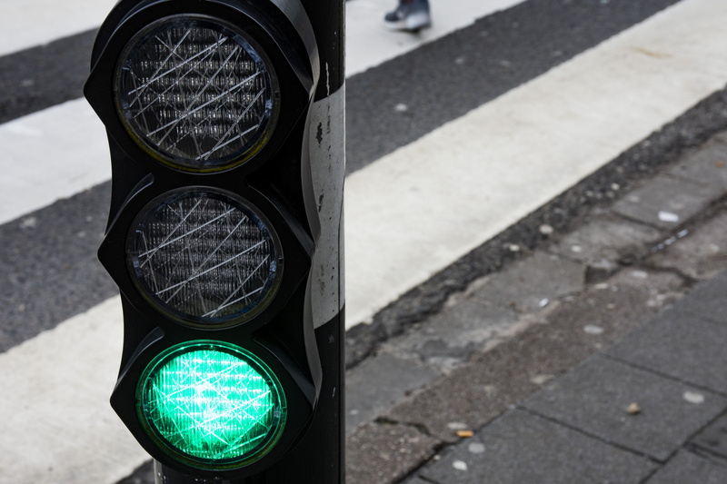green light, headlight, black, traffic light, zebra crossing, tarmac, no people, hydrant, communication, person, day, symbol, asphalt, road signal, stoplight