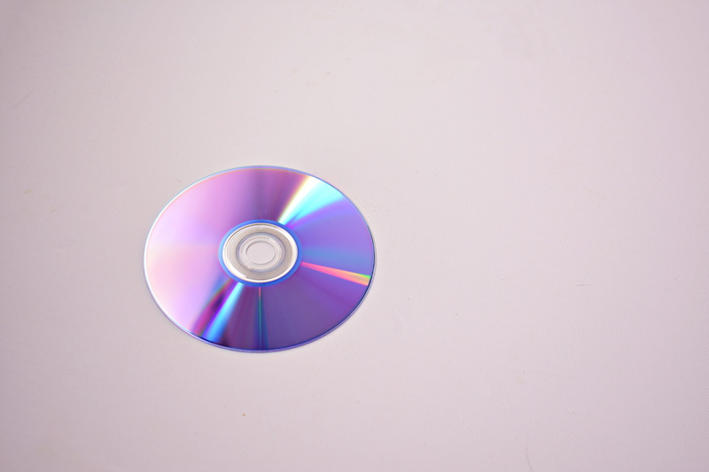 studio shot, close-up, pink color, shape, surface, round out, indoors, gray, background, technology, colors, grey, compact disc, 5K, music, disc, circle