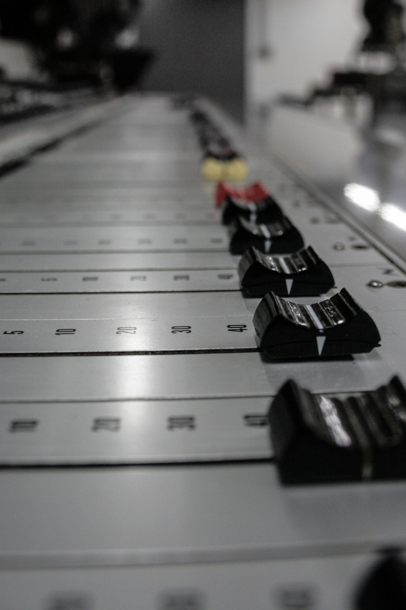 close-up, table, selective focus, electrical equipment, indoors, Mixing Console, musical equipment, focus on foreground, in a row, Mixing, arts culture and entertainment