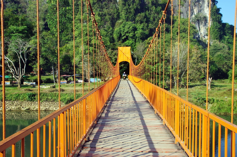 tree, 4K, one person, adults only, leisure activity, bridge - Man Made Structure, real people, diminishing perspective, Vang Vieng, green color, connection