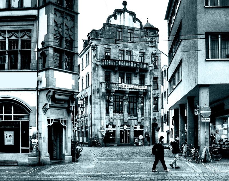 morning hour, real people, building Exterior, freiburg, people, urban Scene, rear view, landmark, city, bicycles, scene, architecture, built Structure