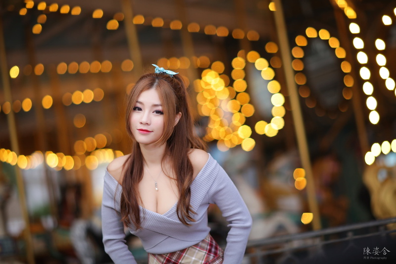 carousel, lights, sweater, long hair, smiling, cleavage, Asian, Karry Chen, outdoors, women outdoors, necklace, women, pink lipstick, looking at viewer