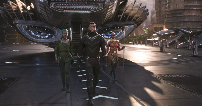 full length, men, lifestyles, young men, building exterior, movies, transportation, city, black panther, young adult, standing, real people, casual clothing