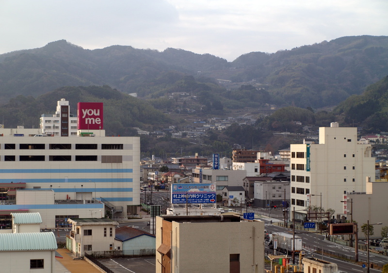 sky, downtown, building, text, City, building exterior, destination, asia, mountain range, nature, mountains, no people, scenery, day, urban, townscape