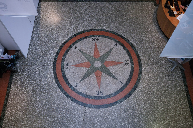 west, circle, compass, sign, orientation, information, indoors, transportation, clock, shape, creativity, directory, no people, navigation, direction, street