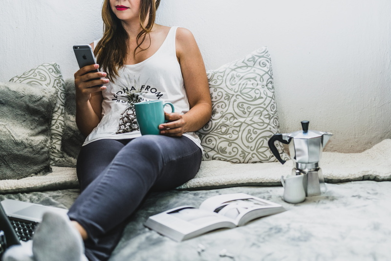 sock, smartphone, sitting, jeans, domestic room, work, woman, girl, furniture, coffee, gray, one person, iphone, beautiful woman, women, drink, hair, indoors