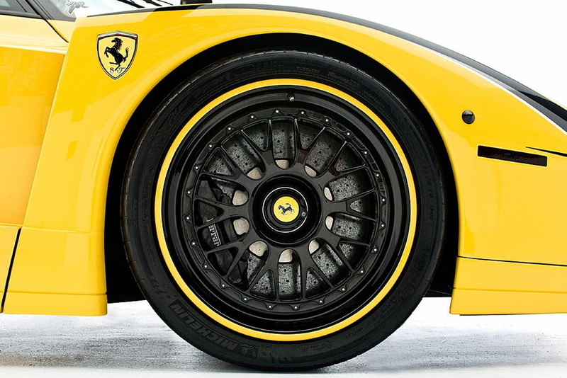 mode of transportation, black color, rubber, day, enzo, evolution, outdoors, transportation, edo, metal, technology, number, close-up, stationary, xx, car