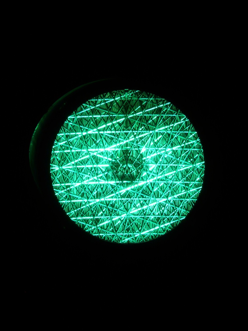 traffic signal, green color, light - natural phenomenon, sign, copy space, shape, stoplight, single object, surface, close-up, light, lighted, road sign