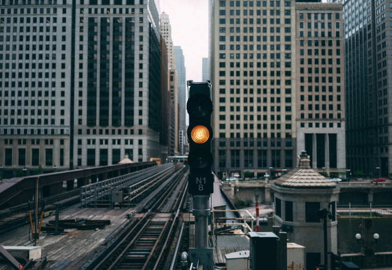 amber light, station, public transportation, railroad, near, office building exterior, view, chicago, built structure, sign, yellow, ready, wait, no people