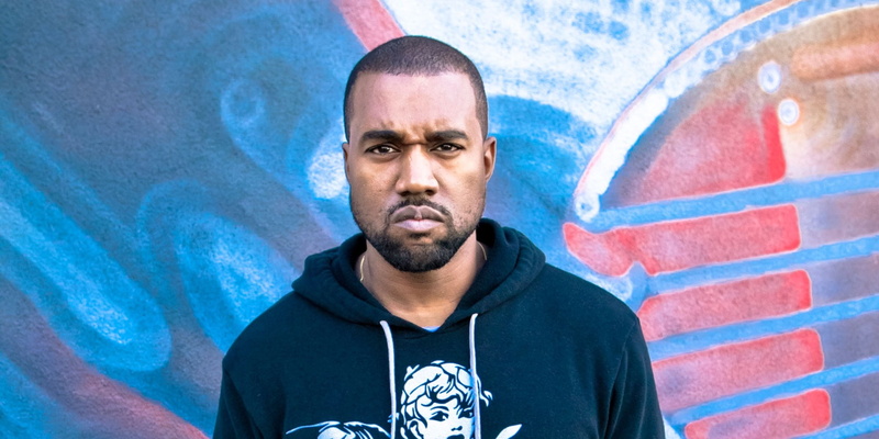 mid adult, individuality, graffiti, one person, kanye west, tattoo, beard, looking at camera, adult, front view, shaved head, standing, casual clothing